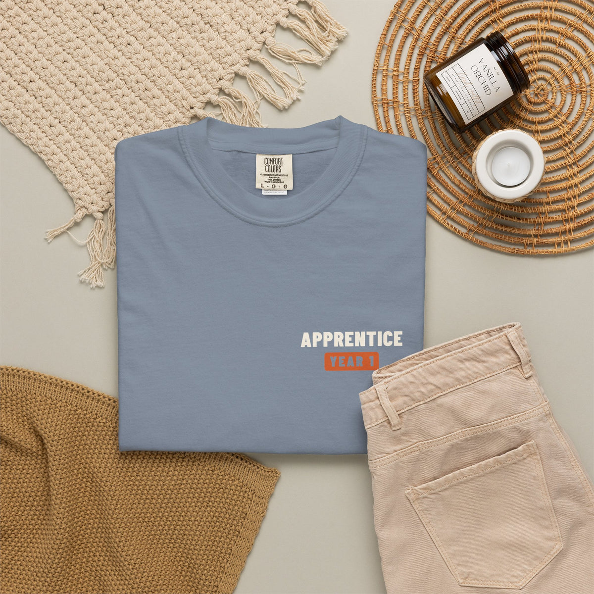 Blue Jean t-shirt flat-lay with a small Apprentice Year 1 tab on the left chest