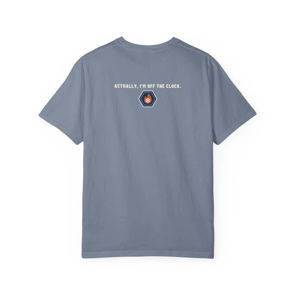 Back of Blue Jean t-shirt reading Actually, I'm Off the Clock with a small fire-and-ice hex nut logo