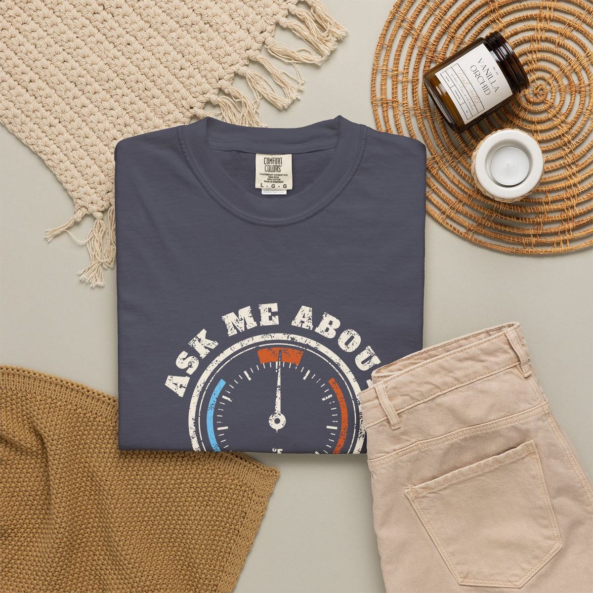 Folded navy t-shirt with a retro gauge graphic and the words Ask Me About My Superheat across the chest