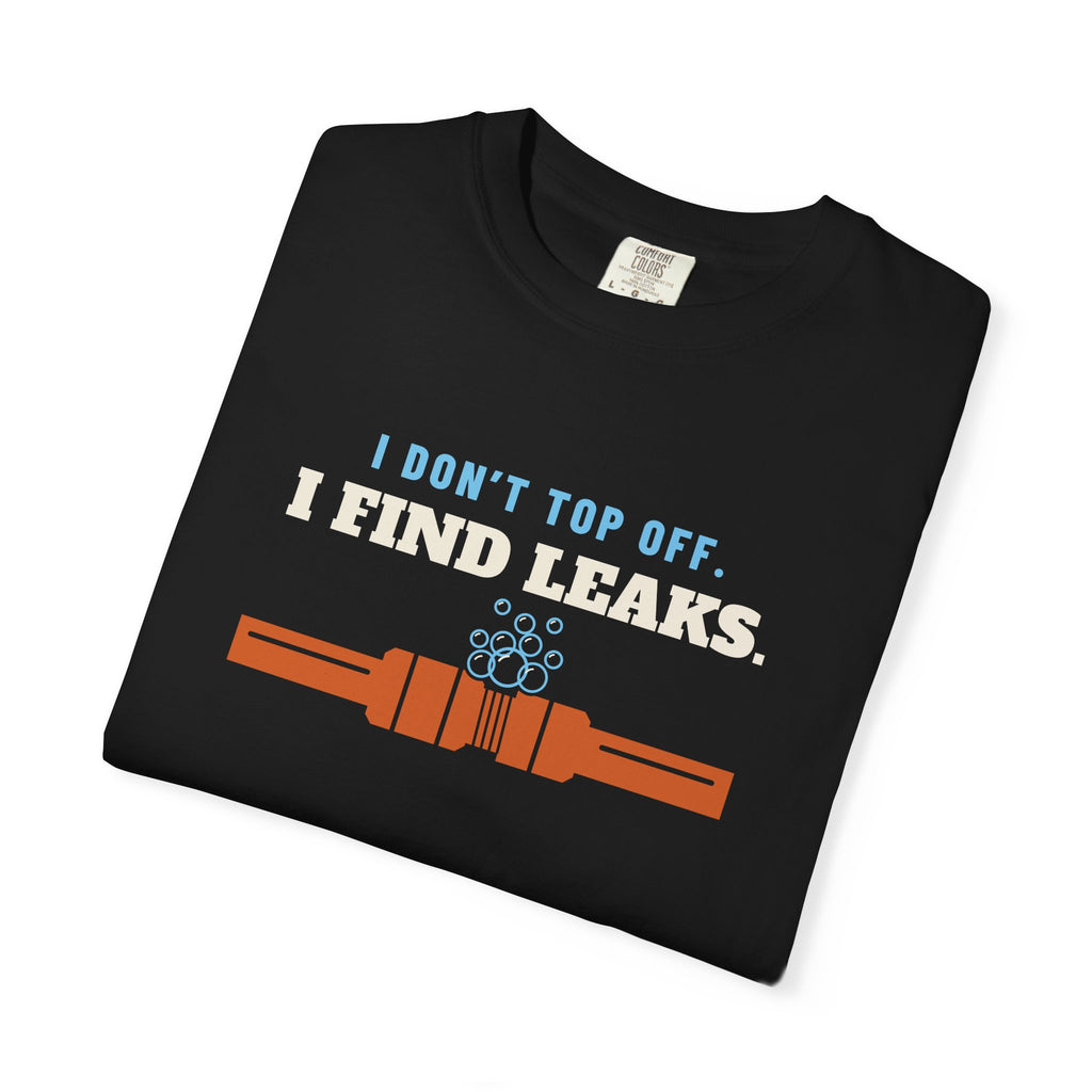 Folded black t-shirt reading I Don't Top Off. I Find Leaks. with leak-check bubbles foaming off a flare fitting