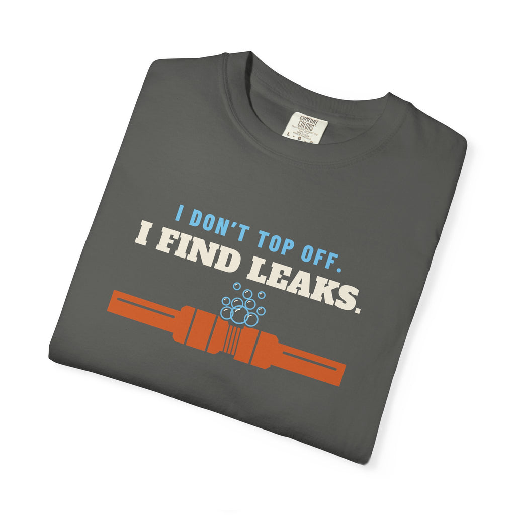 Folded faded black t-shirt reading I Don't Top Off. I Find Leaks. with leak-check bubbles foaming off a flare fitting