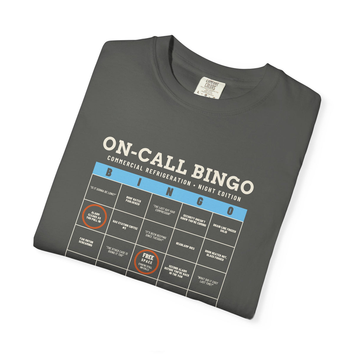 Folded Faded black t-shirt with an On-Call Bingo card for refrigeration night calls