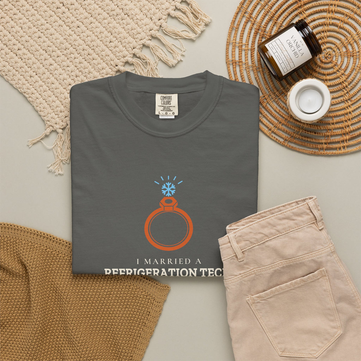 Faded black t-shirt flat-lay with the I Married a Refrigeration Tech flare nut ring graphic