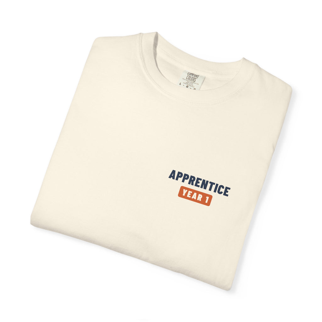 Folded Ivory t-shirt with a small Apprentice Year 1 tab on the left chest