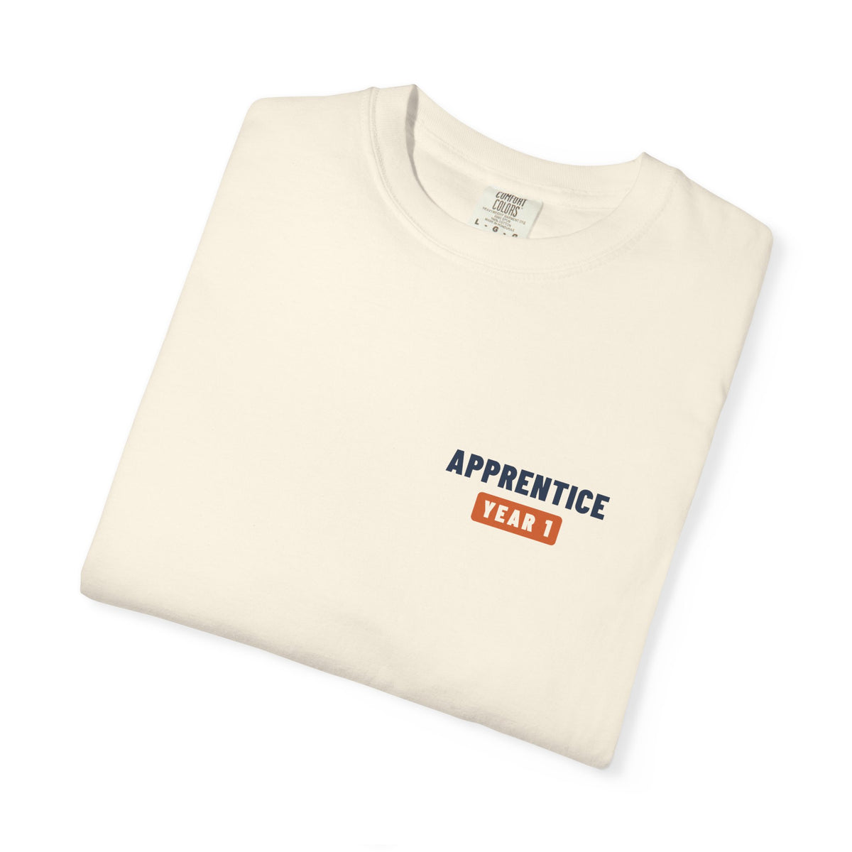Folded Ivory t-shirt with a small Apprentice Year 1 tab on the left chest