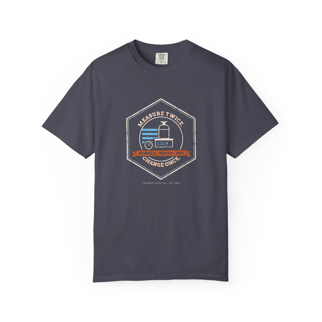 Navy t-shirt with a retro Measure Twice. Charge Once. hex badge with a cylinder on a scale