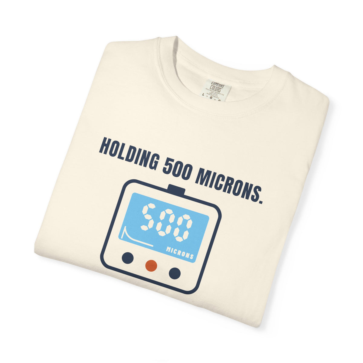 Folded ivory t-shirt reading Holding 500 Microns. Unlike My Patience. with a vacuum gauge graphic