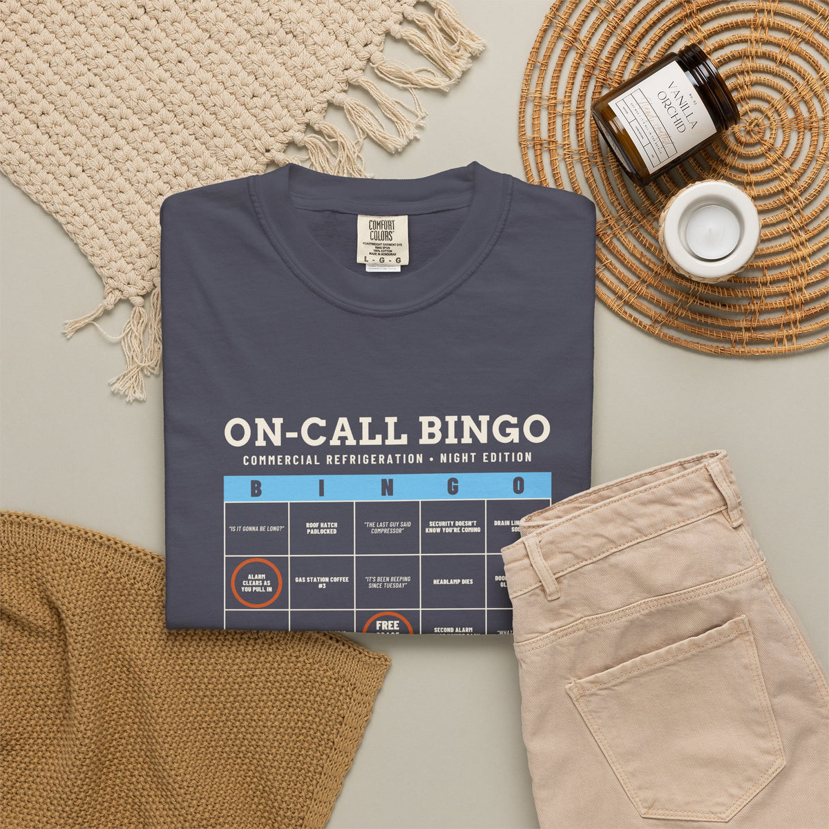 Navy t-shirt flat-lay with an On-Call Bingo card for refrigeration night calls