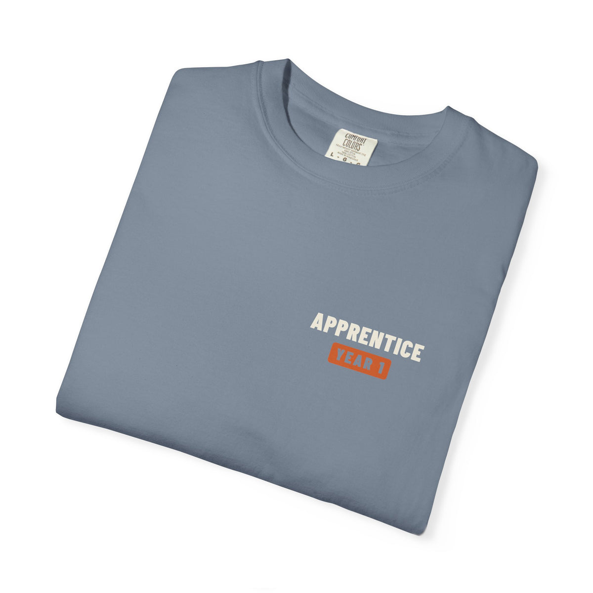 Folded Blue Jean t-shirt with a small Apprentice Year 1 tab on the left chest
