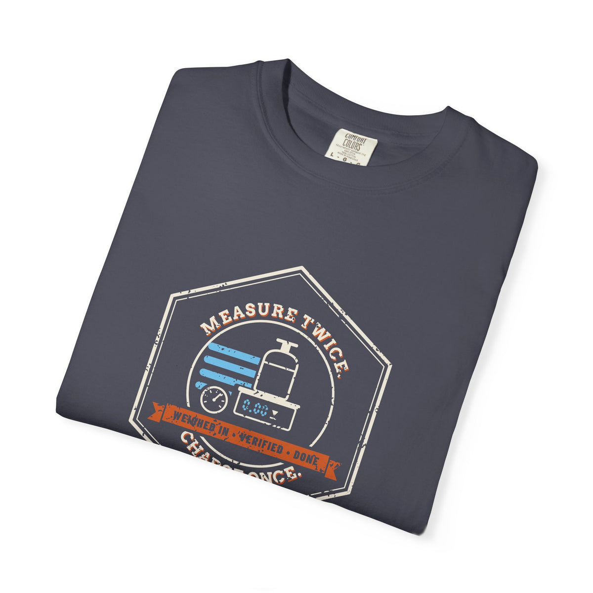 Folded Navy t-shirt with a retro Measure Twice. Charge Once. hex badge with a cylinder on a scale