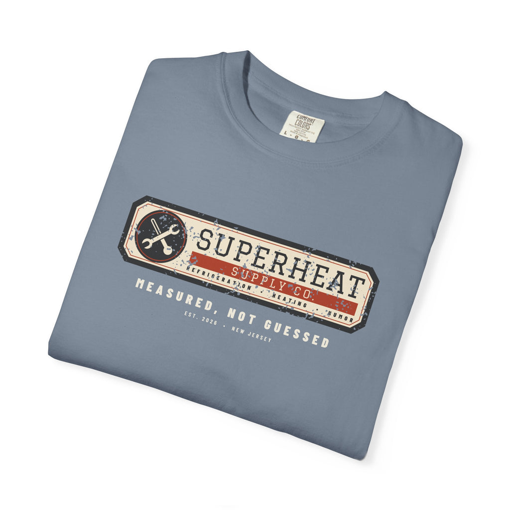 Folded Blue Jean t-shirt with a vintage equipment data plate reading Superheat Supply Co., Refrigeration Heating Humor