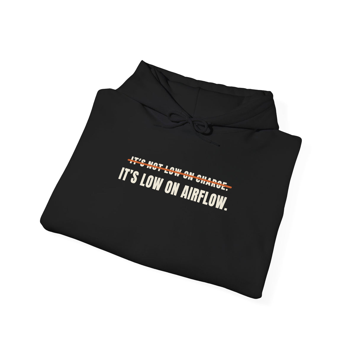 Folded black hoodie reading It's Not Low on Charge, struck through, then It's Low on Airflow across the chest