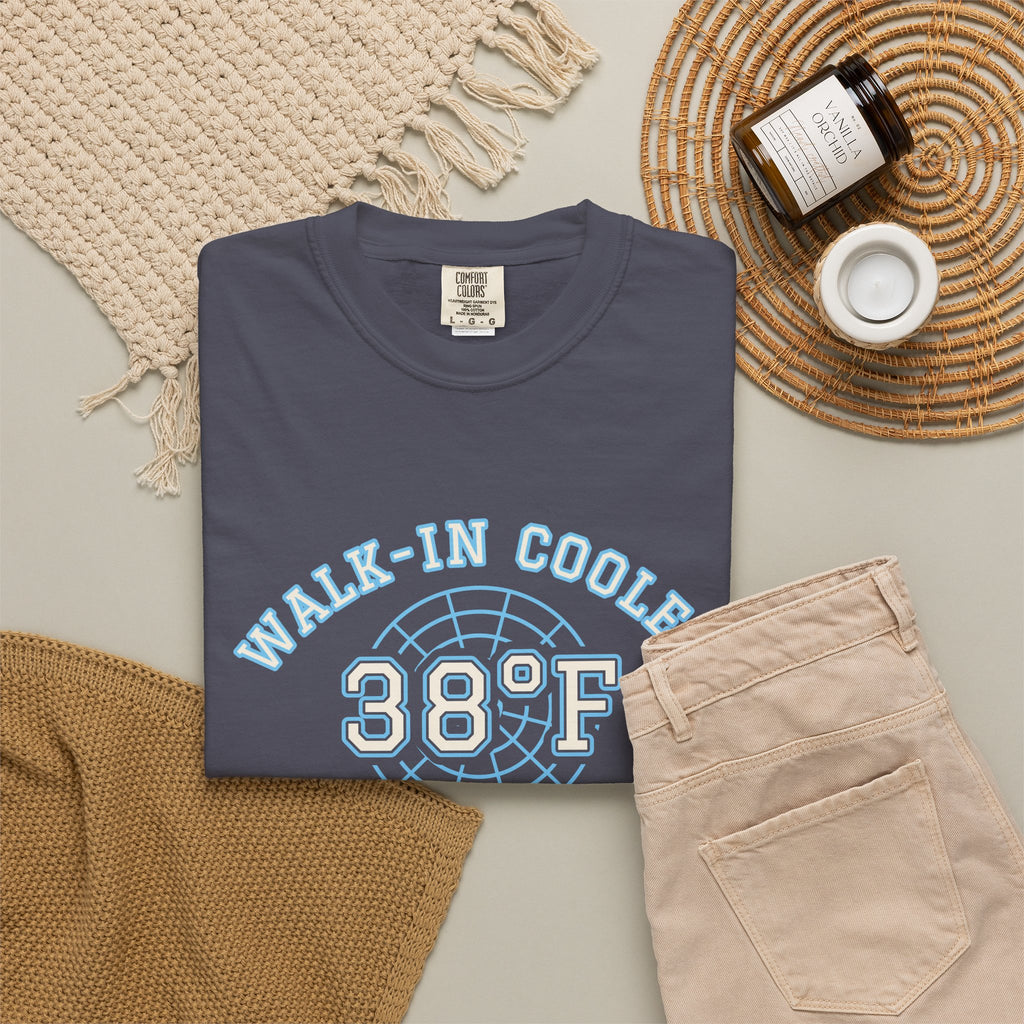 Folded navy t-shirt with a walk-in cooler door badge reading Walk-In Cooler Crew, Box Temp 38°F
