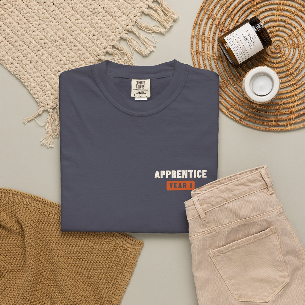 Navy t-shirt flat-lay with a small Apprentice Year 1 tab on the left chest