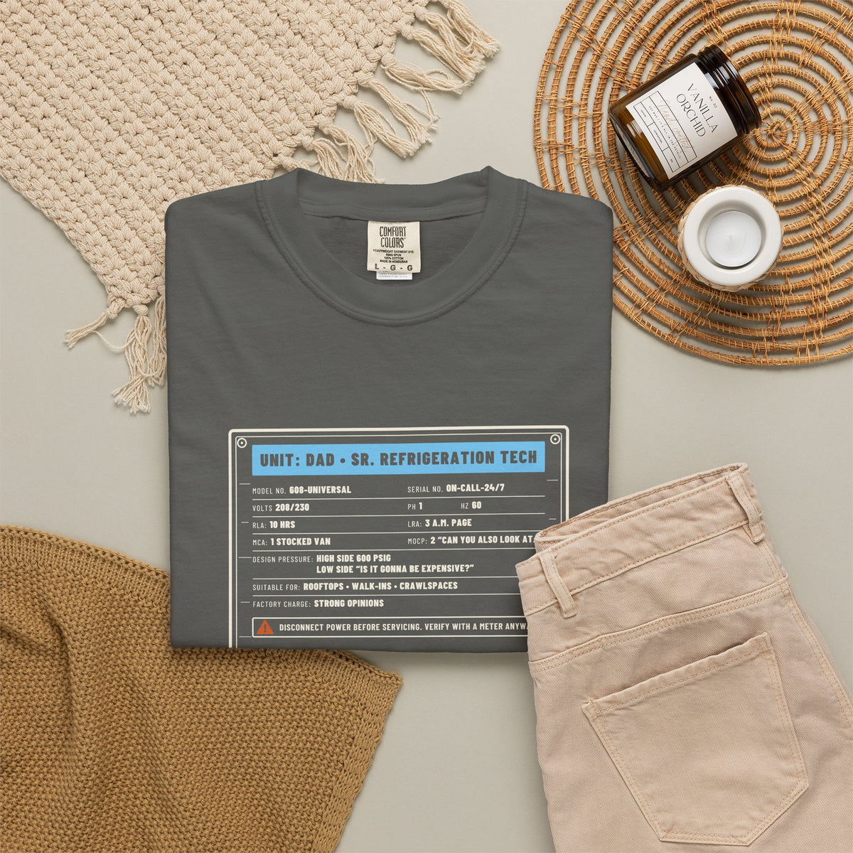 Faded black t-shirt flat-lay with a Unit: Dad Sr. Refrigeration Tech data plate graphic