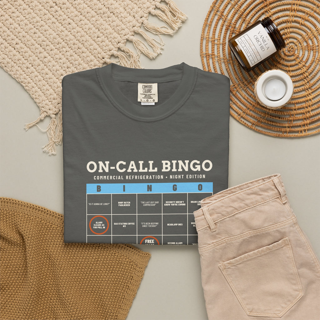 Faded black t-shirt flat-lay with an On-Call Bingo card for refrigeration night calls