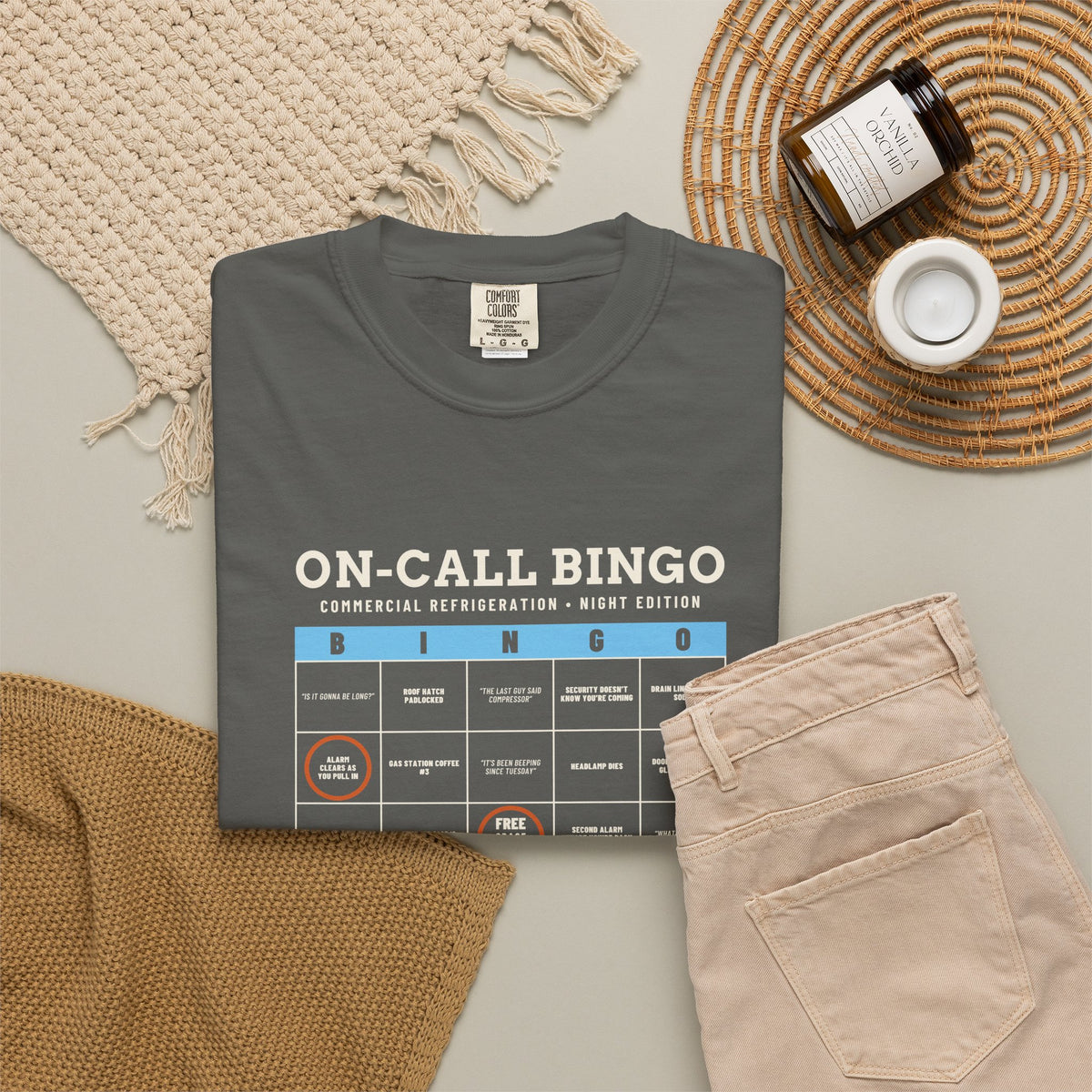 Faded black t-shirt flat-lay with an On-Call Bingo card for refrigeration night calls