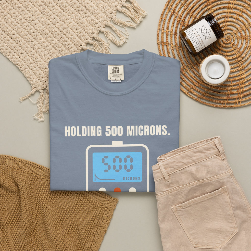 Folded Blue Jean t-shirt reading Holding 500 Microns. Unlike My Patience. with a vacuum gauge graphic
