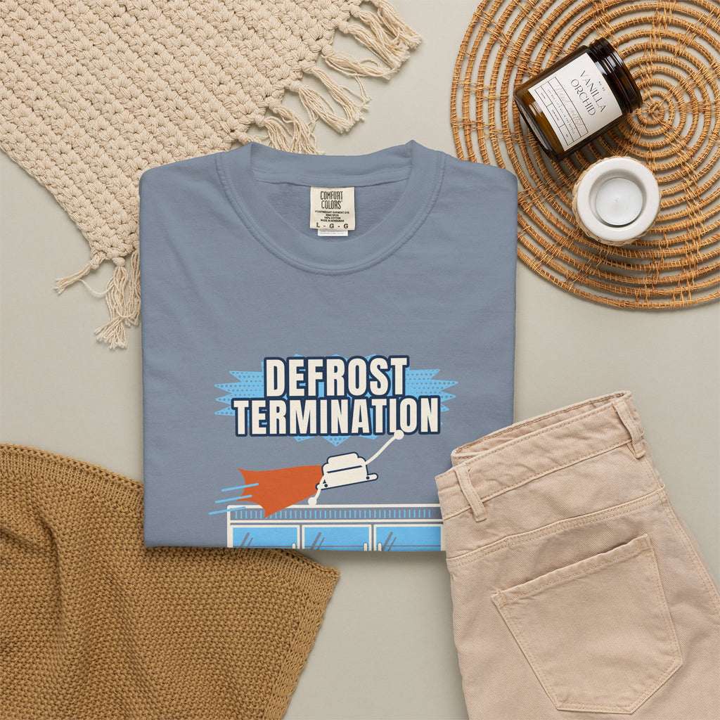 Folded Blue Jean t-shirt reading Defrost Termination, The Real Hero of the Frozen Aisle, with a frosted coil graphic
