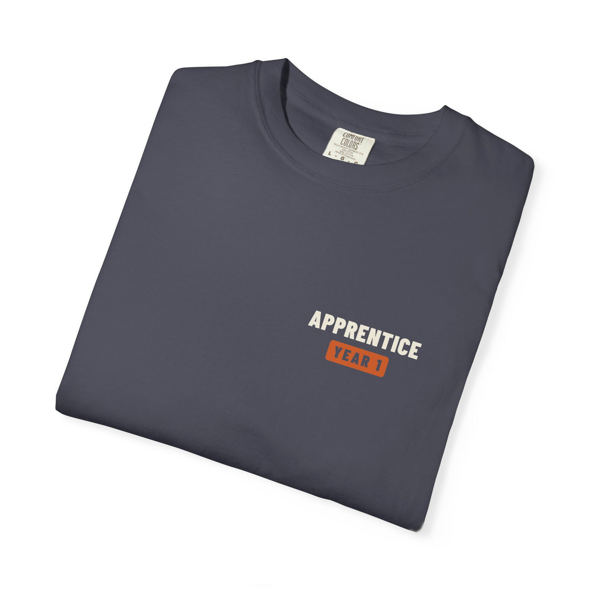 Folded Navy t-shirt with a small Apprentice Year 1 tab on the left chest