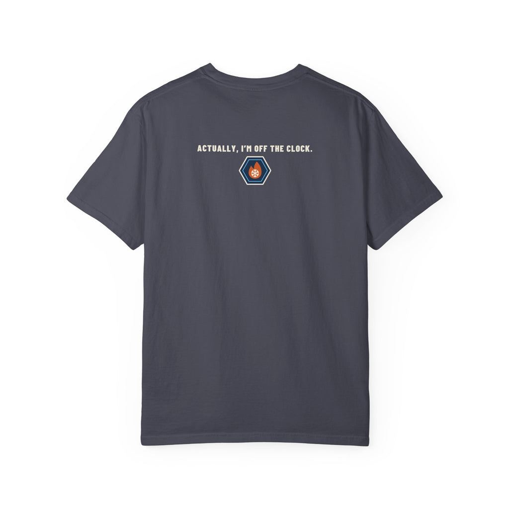 Back of navy t-shirt reading Actually, I'm Off the Clock with a small fire-and-ice hex nut logo