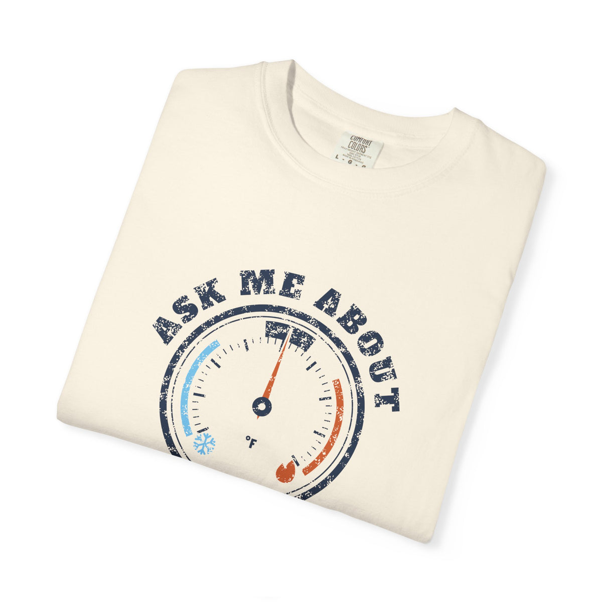 Folded ivory t-shirt with a retro gauge graphic and the words Ask Me About My Superheat across the chest