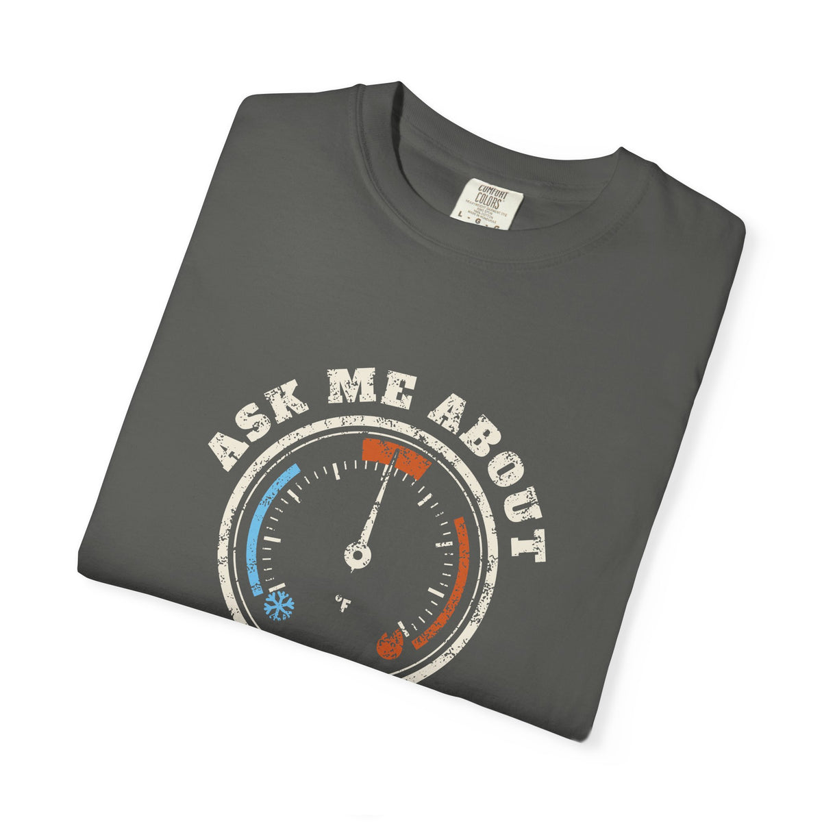 Folded faded black t-shirt with a retro gauge graphic and the words Ask Me About My Superheat across the chest