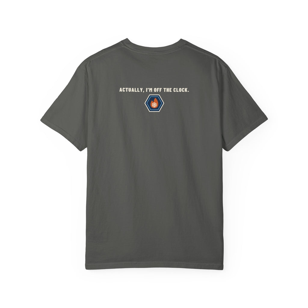 Back of faded black t-shirt reading Actually, I'm Off the Clock with a small fire-and-ice hex nut logo