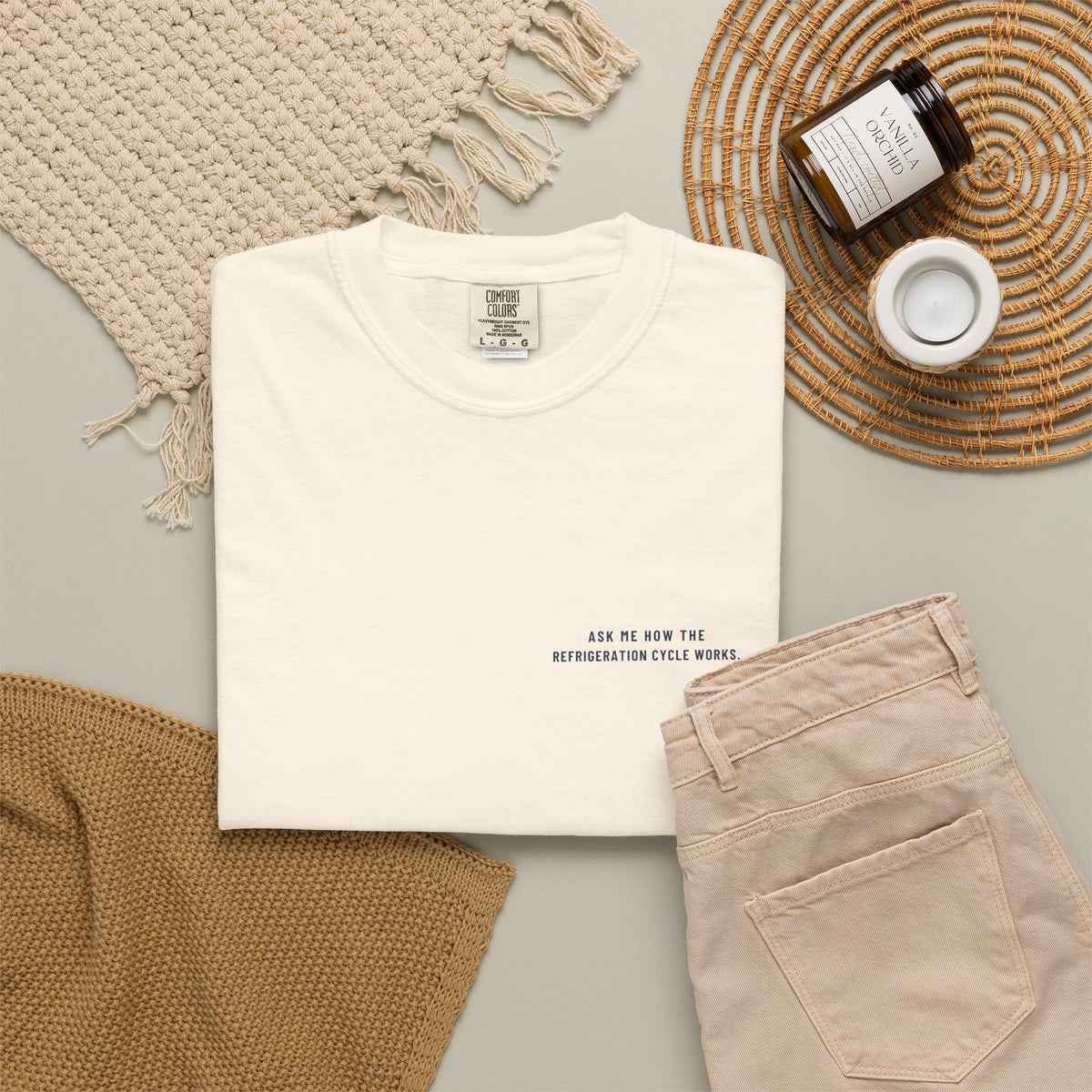 Ivory t-shirt flat-lay with Ask Me How the Refrigeration Cycle Works on the left chest