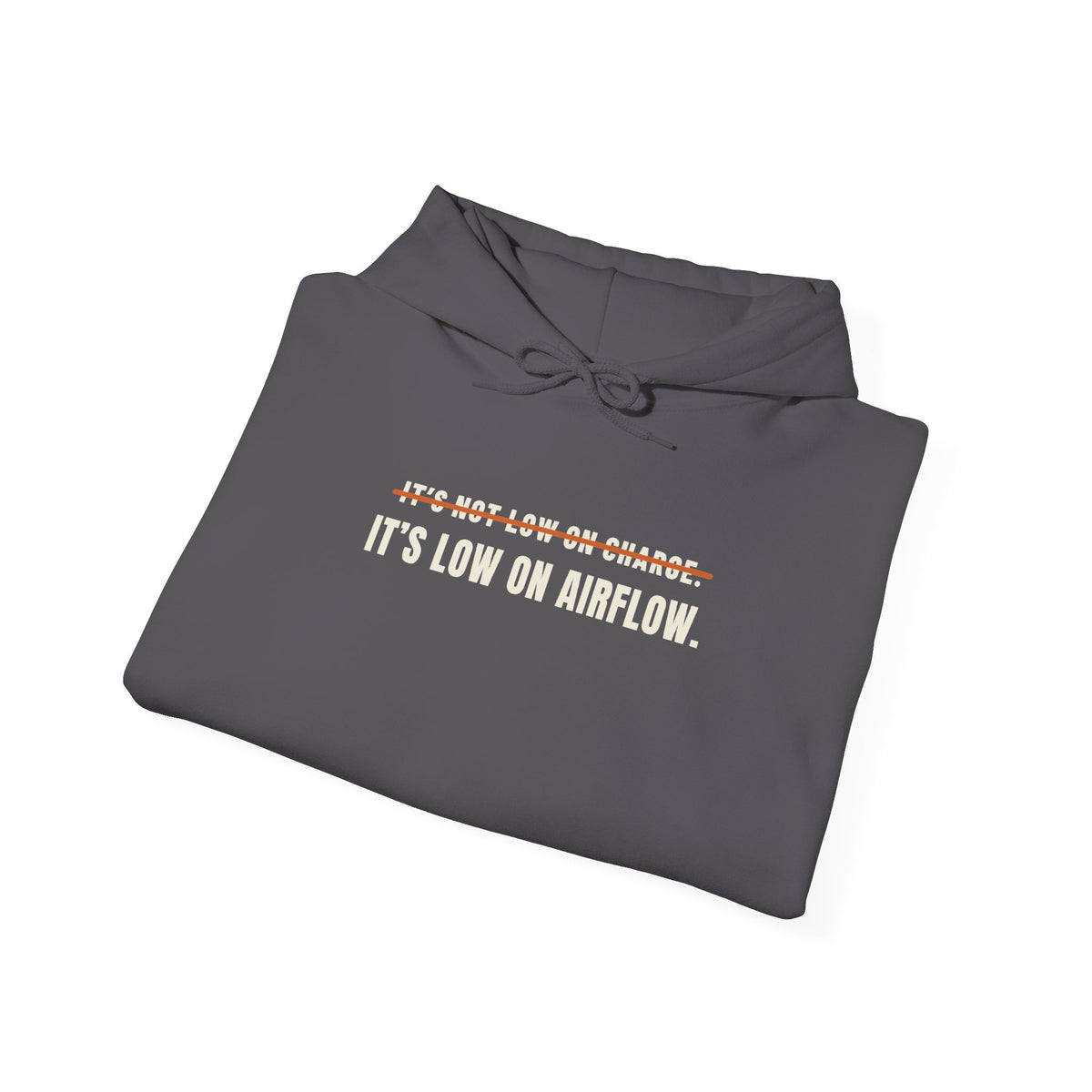 Folded charcoal hoodie reading It's Not Low on Charge, struck through, then It's Low on Airflow across the chest