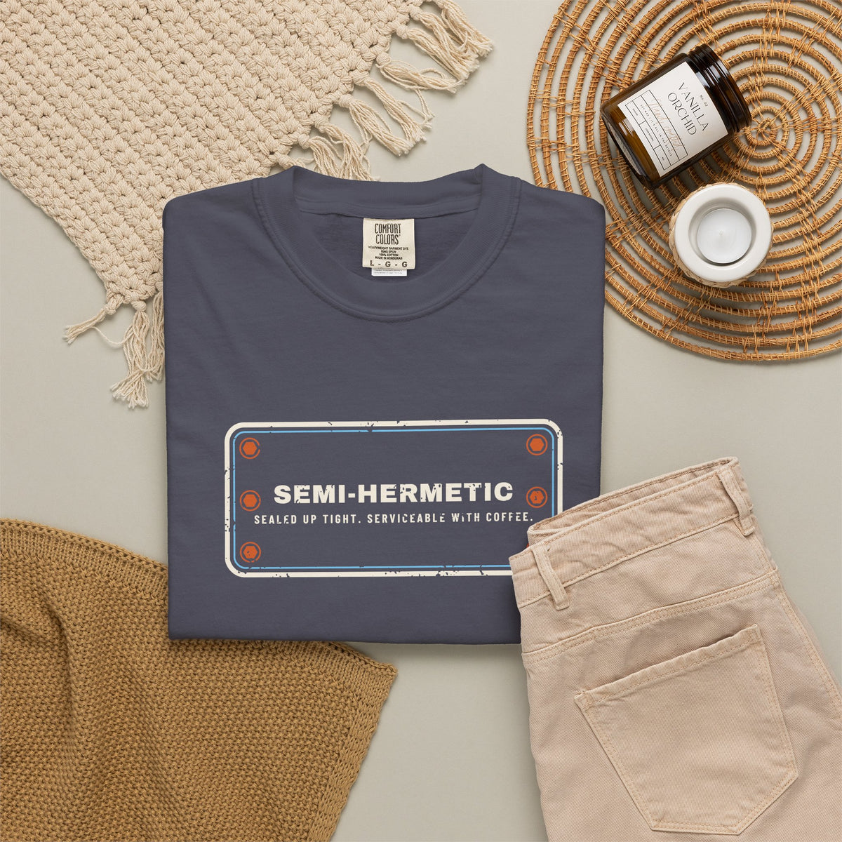 Navy t-shirt flat-lay with SEMI-HERMETIC on a bolted cylinder head plate
